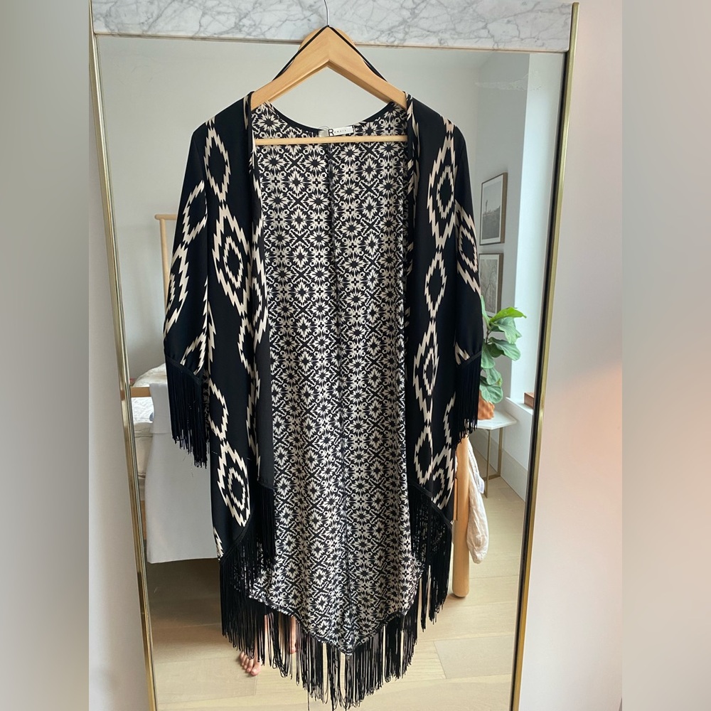 Fun shawl with sleeves and fringe!